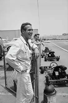 Prints of American actor Paul Newman smiles as he leans against a chainlink fence post at the Go Kart Raceway, in the grounds of the Go Kart factory in Azusa, California, August 1962 Paul Newman: A Life in Frames: Paul Newman, Go Kart Raceway, Azusa, California