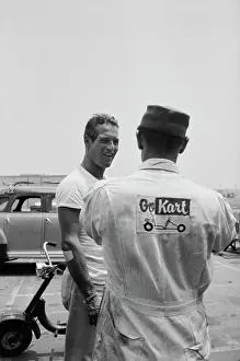 Prints of American actor Paul Newman, wearing a white t-shirt, speaks with a person dressed in overalls at the Go Kart Raceway, in the grounds of the Go Kart factory in Azusa, California, August 1962 Paul Newman: A Life in Frames: Paul Newman, Go Kart Raceway, Azusa, California