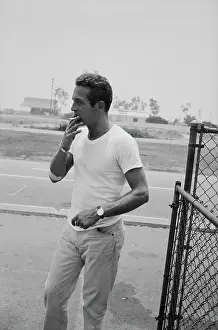 Prints of American actor Paul Newman, wearing a white t-shirt and smoking a cigarette, at the Go Kart Raceway, in the grounds of the Go Kart factory in Azusa, California, August 1962 Paul Newman: A Life in Frames: Paul Newman, Go Kart Raceway, Azusa, California