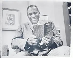 Paul Robeson Examining His Passport
