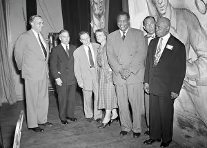 Paul Robeson Posing with Dinner Guests