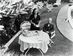 Prints of Actress Paulette Goddard serves tea to her husband. Frequent co-star Charlie Chaplin in a publicity handout from the late 1930's Master of Mime, Icon of Cinema: Chaplin in Prints: Paulette Goddard and Charlie Chaplin