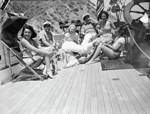 Paulette Goddard Tickling Charlie Chaplin's Feet