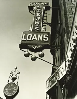Shop Gallery: Pawnbrokers signs outside shop, (B&W), low angle view