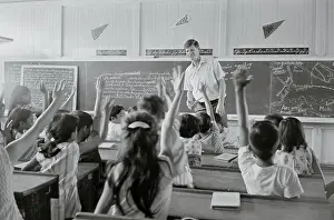 Knowledge Prints: Peace Corps Teacher with His Philippine Classroom