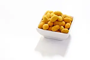 Studio Prints: Peanuts in a paprika flavoured coating, in a bowl