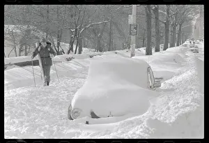 Pedestrian Using Skis to Travel Snowbound City Street
