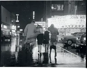 Gloomy Prints: Pedestrians Battling Heavy Wind and Rain