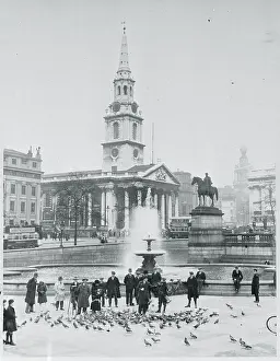 Pedestrians Feeding Pigeons