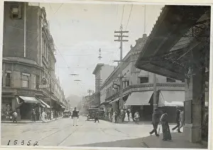 Pedestrians and Motorists on Honolulu Street
