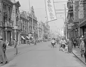 Pedestrians and Travelers on Shanghai Street