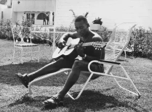 Guitar Prints: Pele Plays Guitar