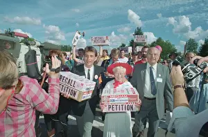 People Carrying Boxes Containing Petitions