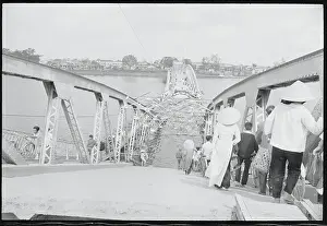 People Crossing a Bridge