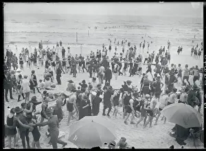 People Dancing in Congo Line at Beach