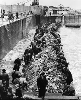 People at Flood Barrier, Plugging Dikes