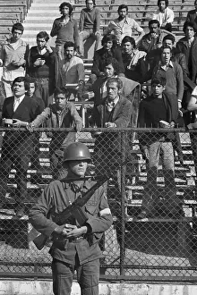 Guarding Prints: People Being Held in National Stadium
