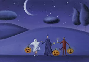 Images Dated 11th September 2009: Three People Holding Hands Dresed in Halloween Costumes and Holding Pumpkins