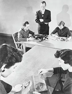 Examination Prints: People Take Intelligence Tests
