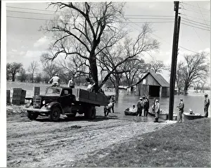 Flood Prints: People Load Feed From Boat To Truck;Floo