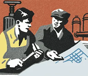 Two People Looking at a Plan