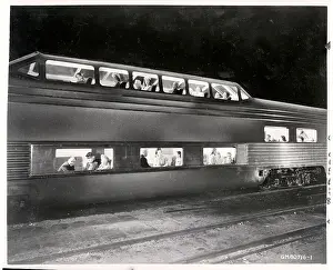 People in Multilevel Futuristic Train