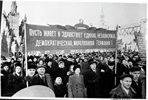 People Parade Through Red Square With Banner