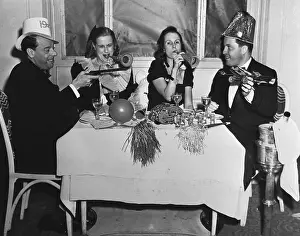 Socialite Prints: People with Party Favors at New Years Party