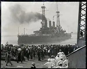 People on Pier Watch Ship Sailing Away