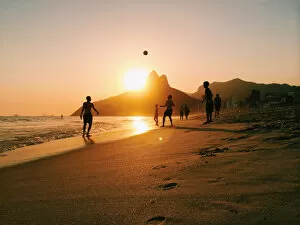 Silhouette Gallery: People playing football on Ipanema beach in Rio