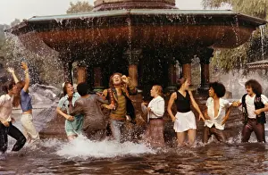 People Playing in a Fountain