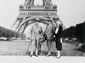 People Posing in Front of the Eiffel Tower