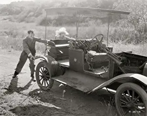 Disrepair Prints: People Pushing an Old Auto