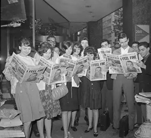People Reading Newspapers with Gordon Cooper Headline