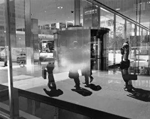 People reflected in window, New York City