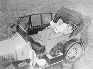 Camping Prints: People Relaxing in a Camping Car