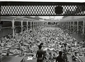 People Relaxing By a Swimming Pool