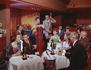 Mid Adult Collection: People in restaurant listening musical performance