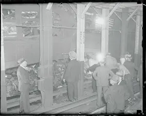 Tunnel Prints: People Reviewing Wreckage