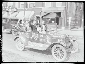 People Riding in Graffiti Covered Car
