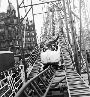 People Riding a Roller Coaster