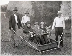 Sled Prints: Three People Seated In Wicker Tobaggan
