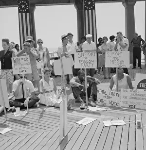 People Sitting with Protest Signs