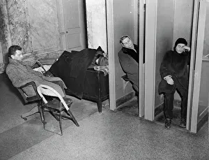 People Sleeping in Lobby Phone Booths