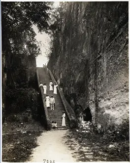 People Stand on Large Outdoor Stairway