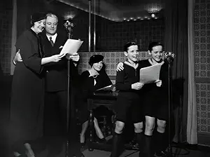 Program Prints: People In Studio Making Radio About Fami