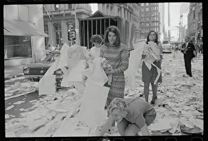 People Tossing Papers in the Street