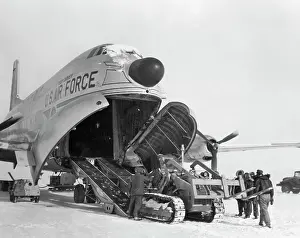 Ottawa Prints: People Unloading Cargo From a Transport Plane