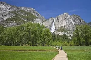 People Walking on Boardwalk Near Yosemite Waterfall