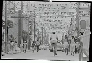 People Walking and Riding in Street of Belize